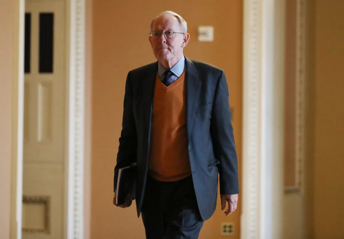 Sen. Lamar Alexander (R-Tenn.) walks on his way to enter the Senate chamber in the U.S. Capitol in Washington, on Jan. 24, 2020. (Mario Tama/Getty Images)