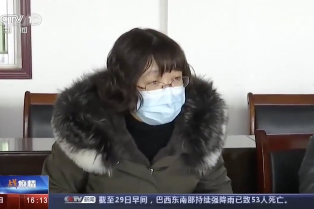 Tang Zhihong, chief of Huanggang health commission, is keeping silent when Beijing experts asked her the epidemic status in Huanggang, China on Jan. 29, 2020. (Screenshot)