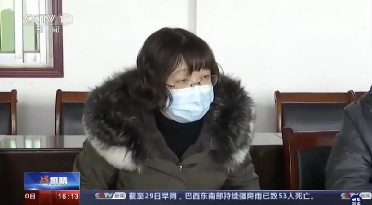 Tang Zhihong, chief of Huanggang health commission, is keeping silent when Beijing experts asked her the epidemic status in Huanggang, China on Jan. 29, 2020. (Screenshot)