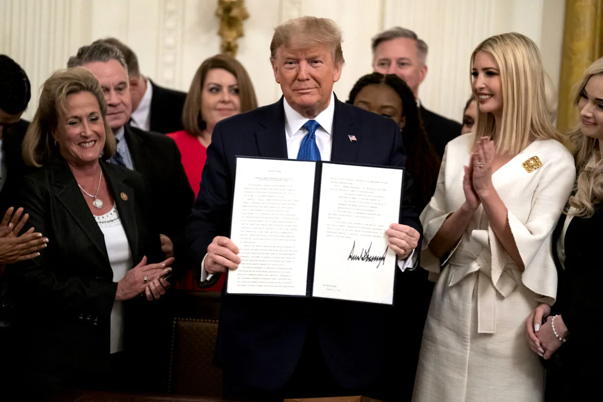President Donald Trump presents an executive order to help combat human trafficking, in the East Room of the White House in Washington on Jan. 31, 2020. (Evan Vucci/AP Photo)