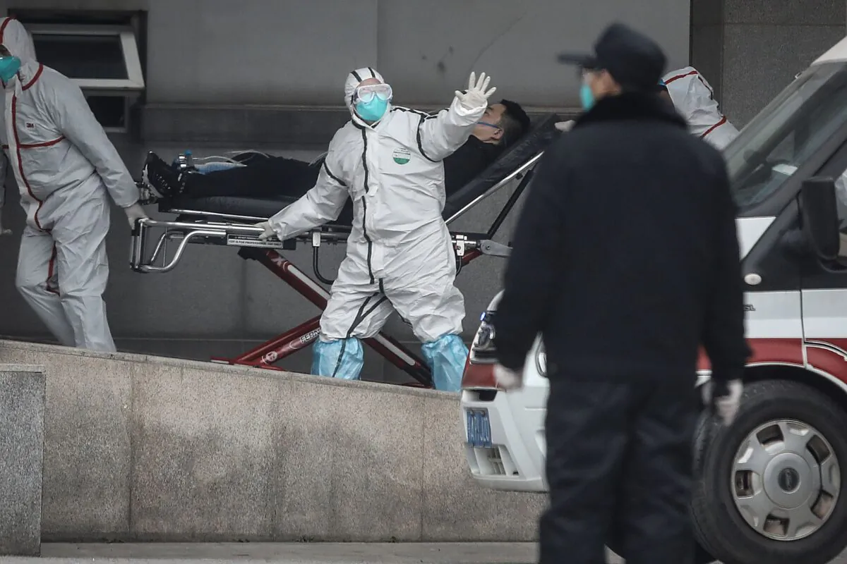 Medical staff transfer patients to Wuhan Jinyintan Hospital in  China on Jan. 17, 2020. (Getty Images)