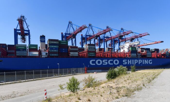 Chinese container ship "Cosco Shipping Aries" is unloaded at a loading terminal in the port of Hamburg Germany on July 27, 2018. (Fabian Bimmer/Reuters)