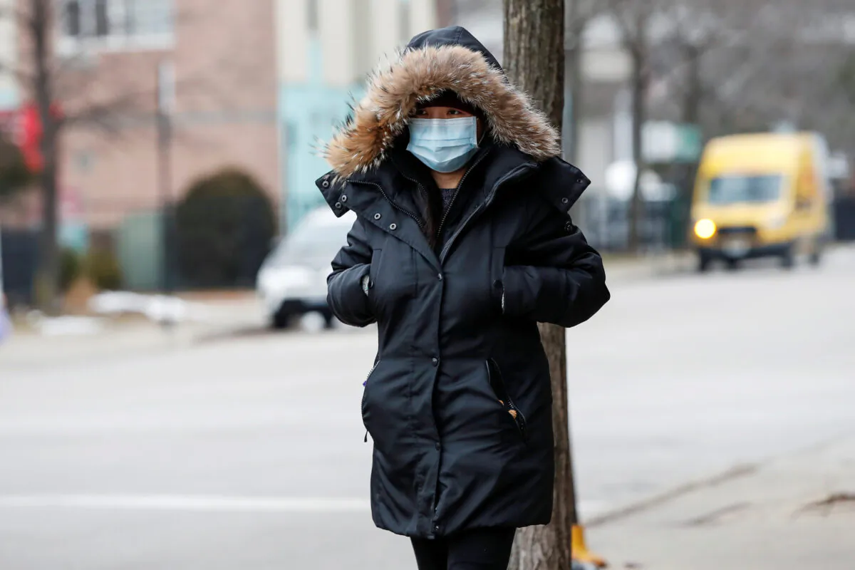 A woman wears a mask in Chinatown following the outbreak of the novel coronavirus, in Chicago, Illinois, U.S. Jan. 30, 2020. (Reuters/Kamil Krzaczynski/File Photo)