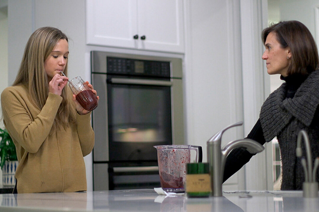 18-year-old Nina Nichols takes her daily dose of Palforzia as her mother, Maria Acebal watches, in her home in Washington on Jan. 10, 2020. (Federica Narancio/AP Photo)