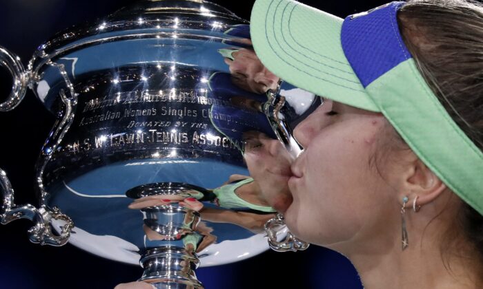 Sofia Kenin of the U.S. kisses the Daphne Akhurst Memorial Cup after defeating Spain's Garbine Muguruza in the women's singles final at the Australian Open tennis championship in Melbourne, Australia on Feb. 1, 2020. (Lee Jin-man/AP Photo)