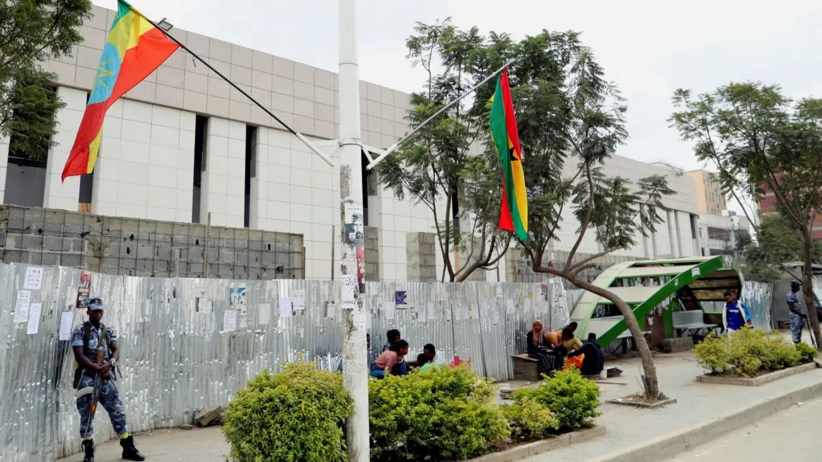 Federal police officers stand guard near Ethiopian national flags along the street in Addis Ababa, Ethiopia, on Nov. 15, 2018. (Tiksa Negeri/Reuters)