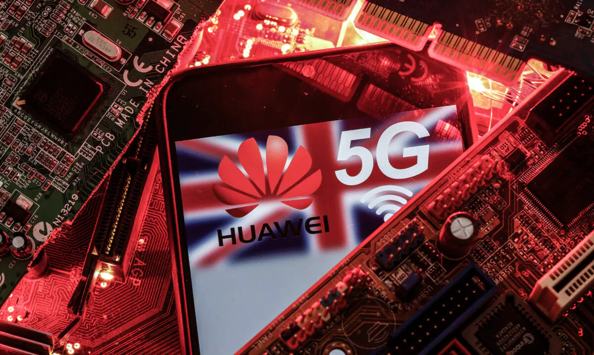 The British flag and a smartphone with a Huawei and 5G network logo are seen on a PC motherboard in this illustration picture taken on Jan. 29, 2020. (Dado Ruvic/Illustration/Reuters)