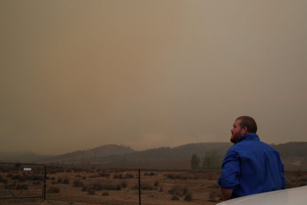 Local resident Peter Lawlis monitors an approaching bushfire