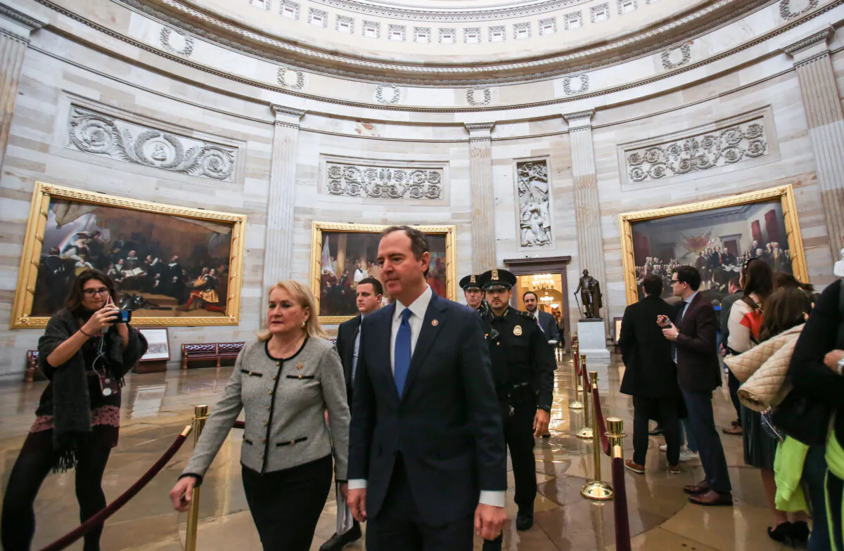 House managers Rep. Sylvia Garcia (D-Texas) and Rep. Adam Schiff (D-Calif.) walk to the Senate Chamber on the 10th day of the impeachment trial of President Donald Trump at the Capitol in Washington on Jan. 31, 2020. (Charlotte Cuthbertson/The Epoch Times)