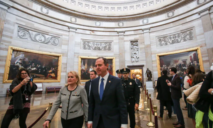 House managers Rep. Sylvia Garcia (D-Texas) and Rep. Adam Schiff (D-Calif.) walk to the Senate Chamber on the 10th day of the impeachment trial of President Donald Trump at the Capitol in Washington on Jan. 31, 2020. (Charlotte Cuthbertson/The Epoch Times)