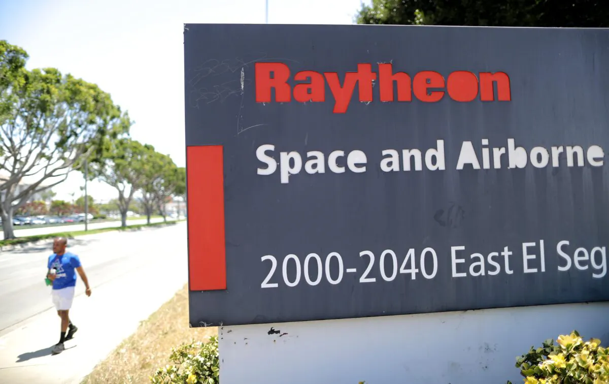 A sign is posted at a Raytheon Co. campus in El Segundo, Calif. on June 10, 2019. A former engineer at Raytheon Missile Systems was indicted on charges of violating U.S. export control laws. (Mario Tama/Getty Images)
