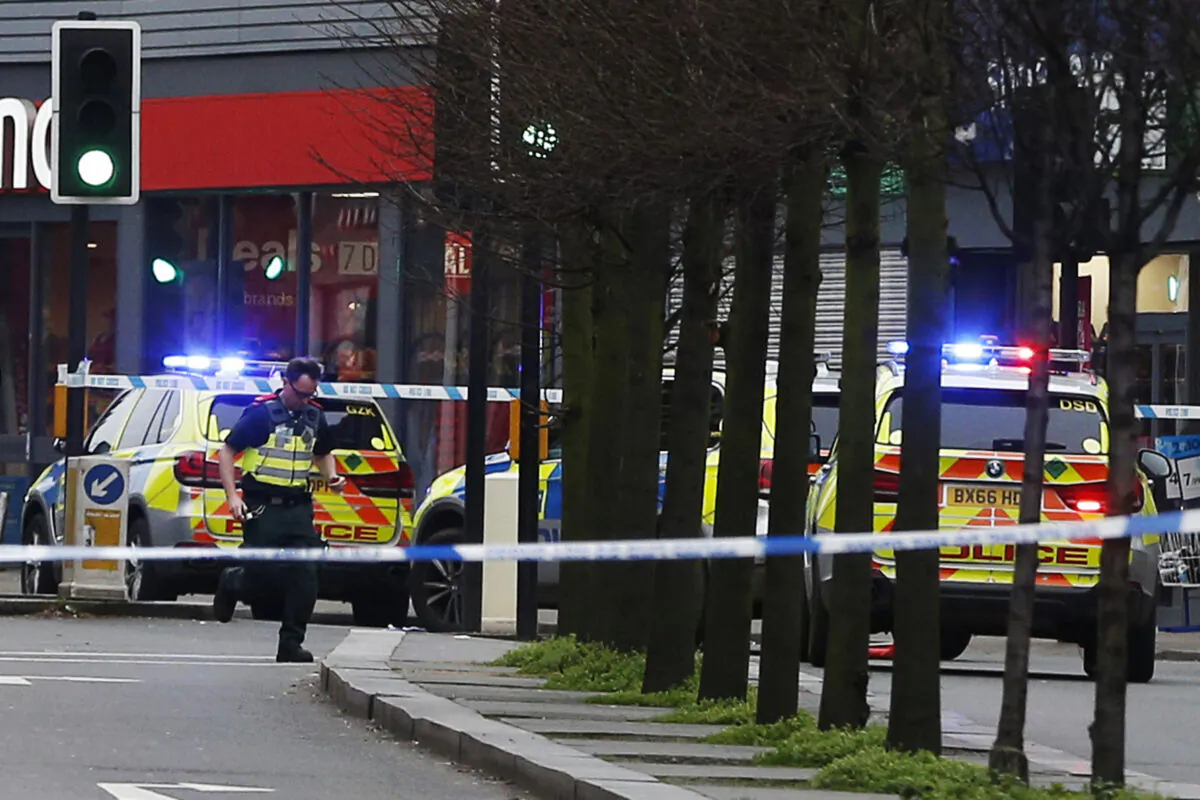 Police officers at the scene after a man was shot and killed by armed police in London, England, on Feb. 2, 2020. (Hollie Adams/Getty Images)