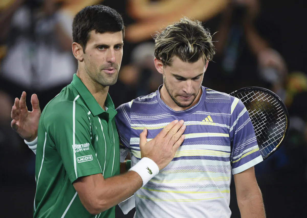 Serbia's Novak Djokovic is congratulated by Austria's Dominic Thiem after winning the men’s singles final at the Australian Open tennis championship in Melbourne, Australia, on Feb. 2, 2020. (Andy Brownbill/AP Photo)