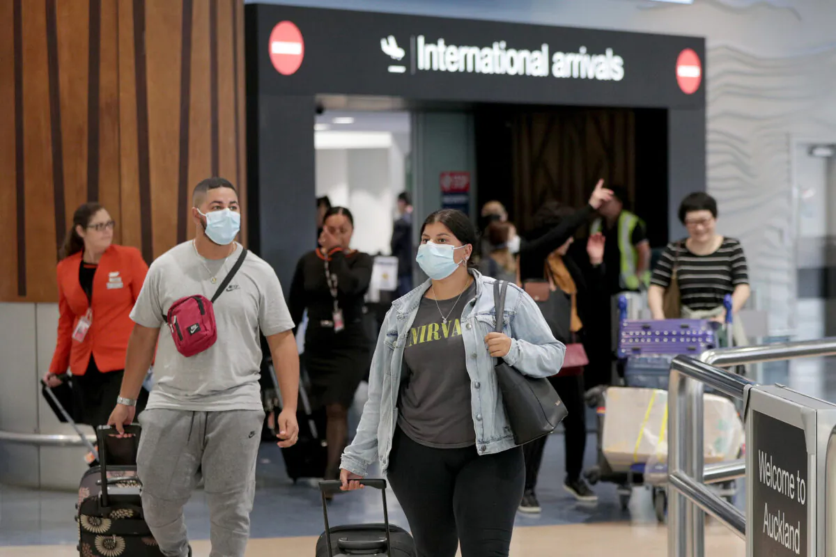 Passengers arriving on flights wear protective masks at the international airport in Auckland, New Zealand, on Jan. 29, 2020. (Dave Rowland/Getty Images)