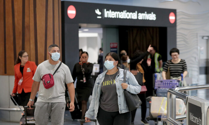 Passengers arriving on flights wear protective masks at the international airport in Auckland, New Zealand, on Jan. 29, 2020. (Dave Rowland/Getty Images)