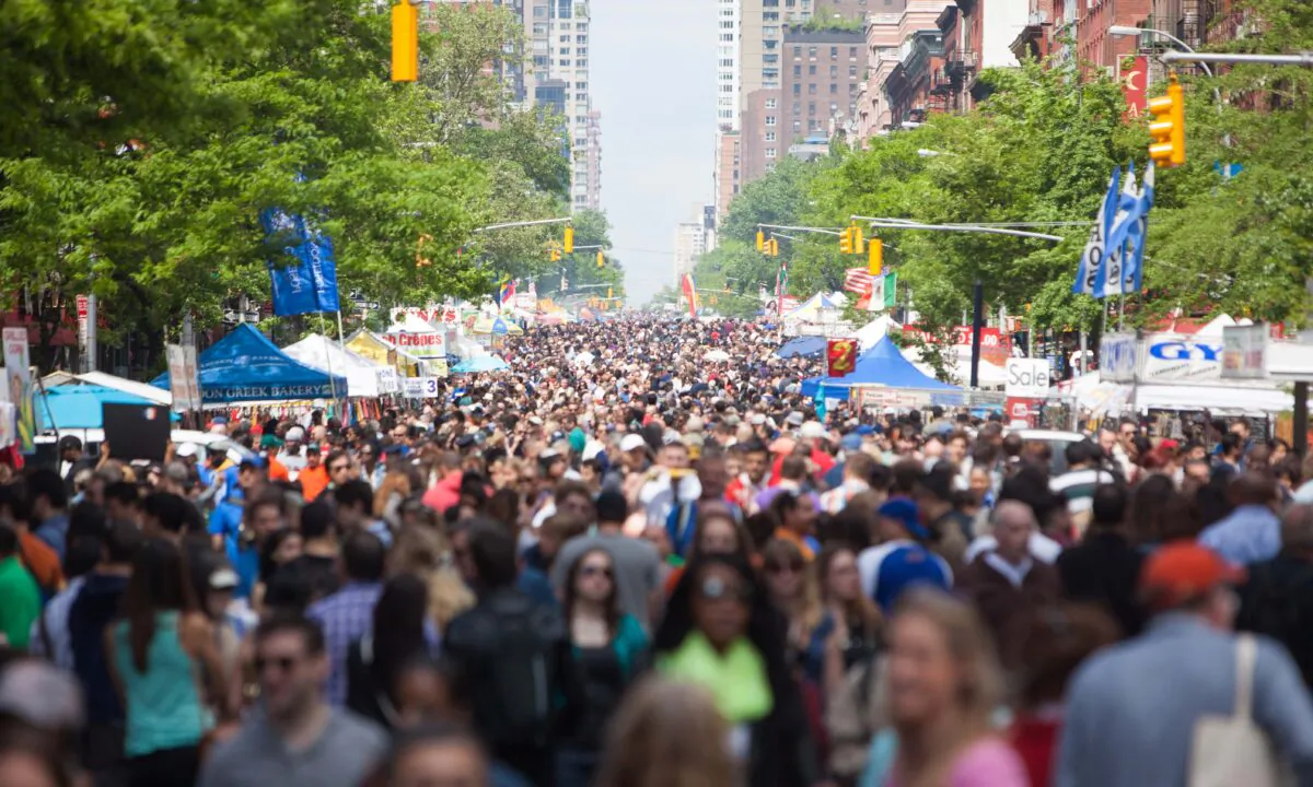 Thousands of people shop at booths at the Ninth Avenue International Food Festival, in New York City, on May 18, 2014.  Petr Svab/The Epoch Times
