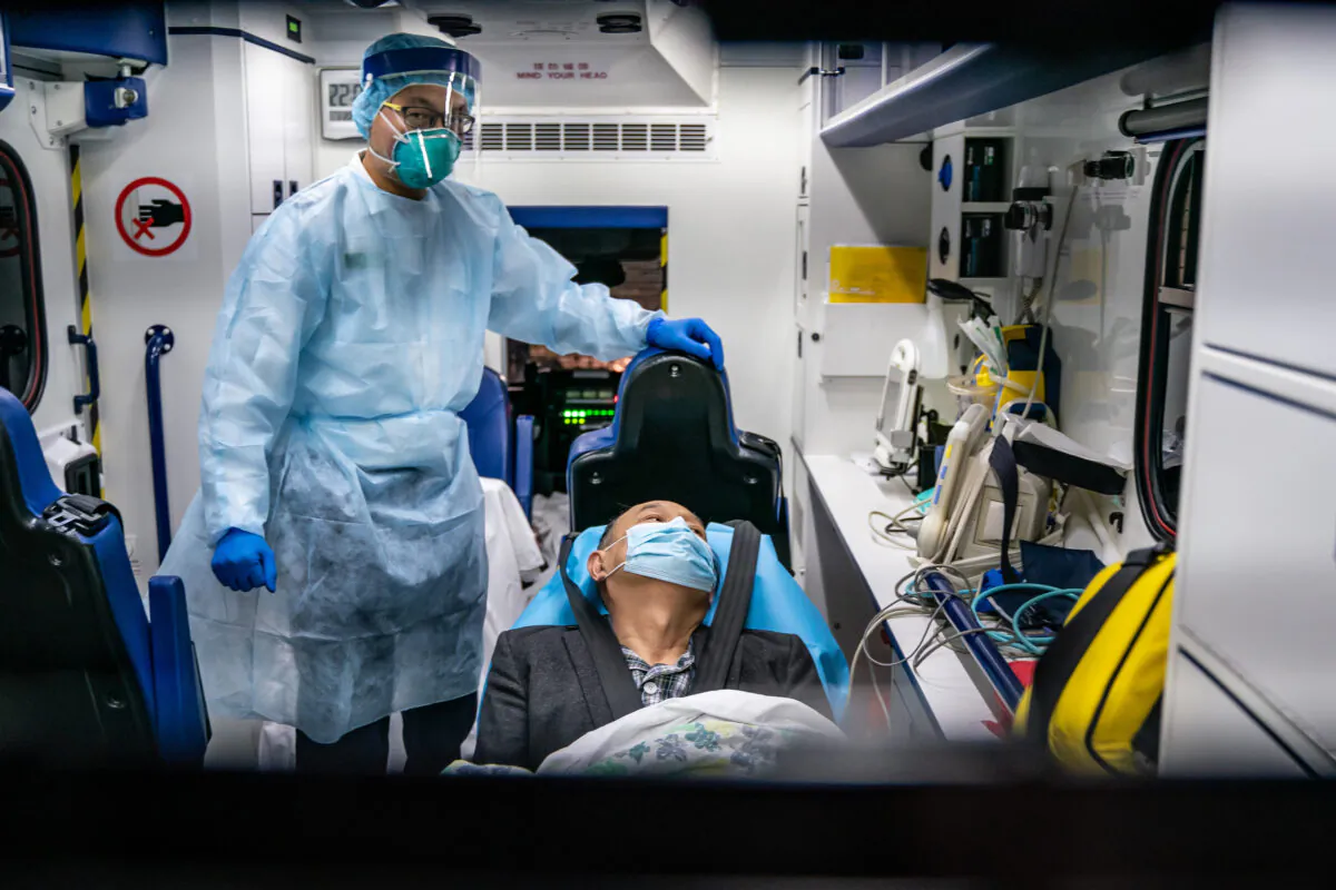A patient is transferred by an ambulance to the Infectious Disease Centre of Princess Margaret Hospital in Hong Kong, China, on Jan. 22, 2020. (Anthony Kwan/Getty Images)