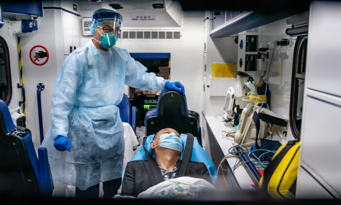 A patient is transferred by an ambulance to the Infectious Disease Centre of Princess Margaret Hospital in Hong Kong, China, on Jan. 22, 2020.  (Anthony Kwan/Getty Images)