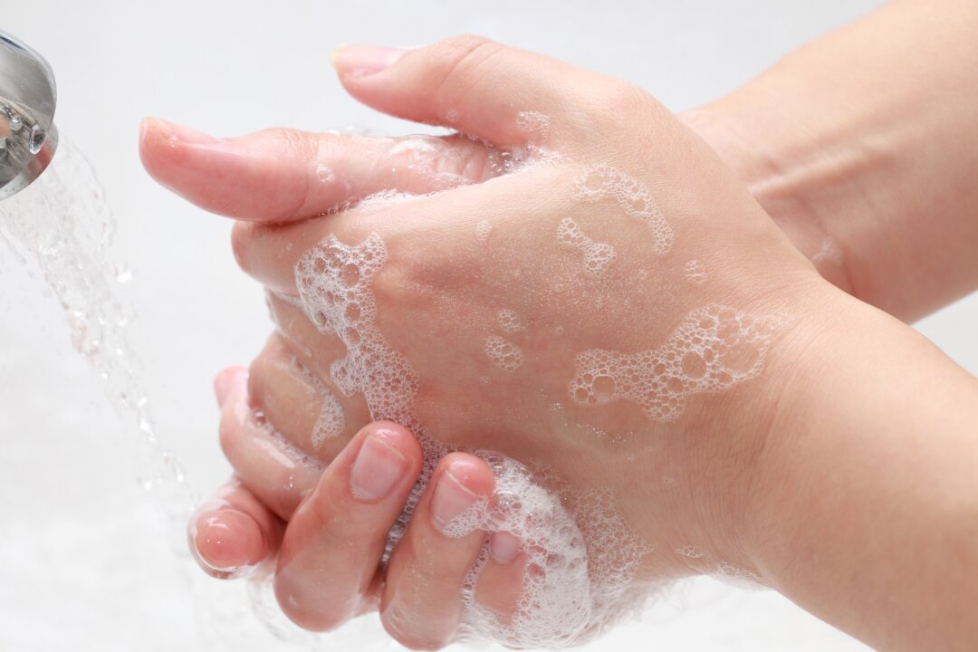The most common way to pick up a virus is to literally pick it up. For that reason, nothing beats some hot water and soap, not even an N95 respirator.(Gang Liu/Shutterstock)