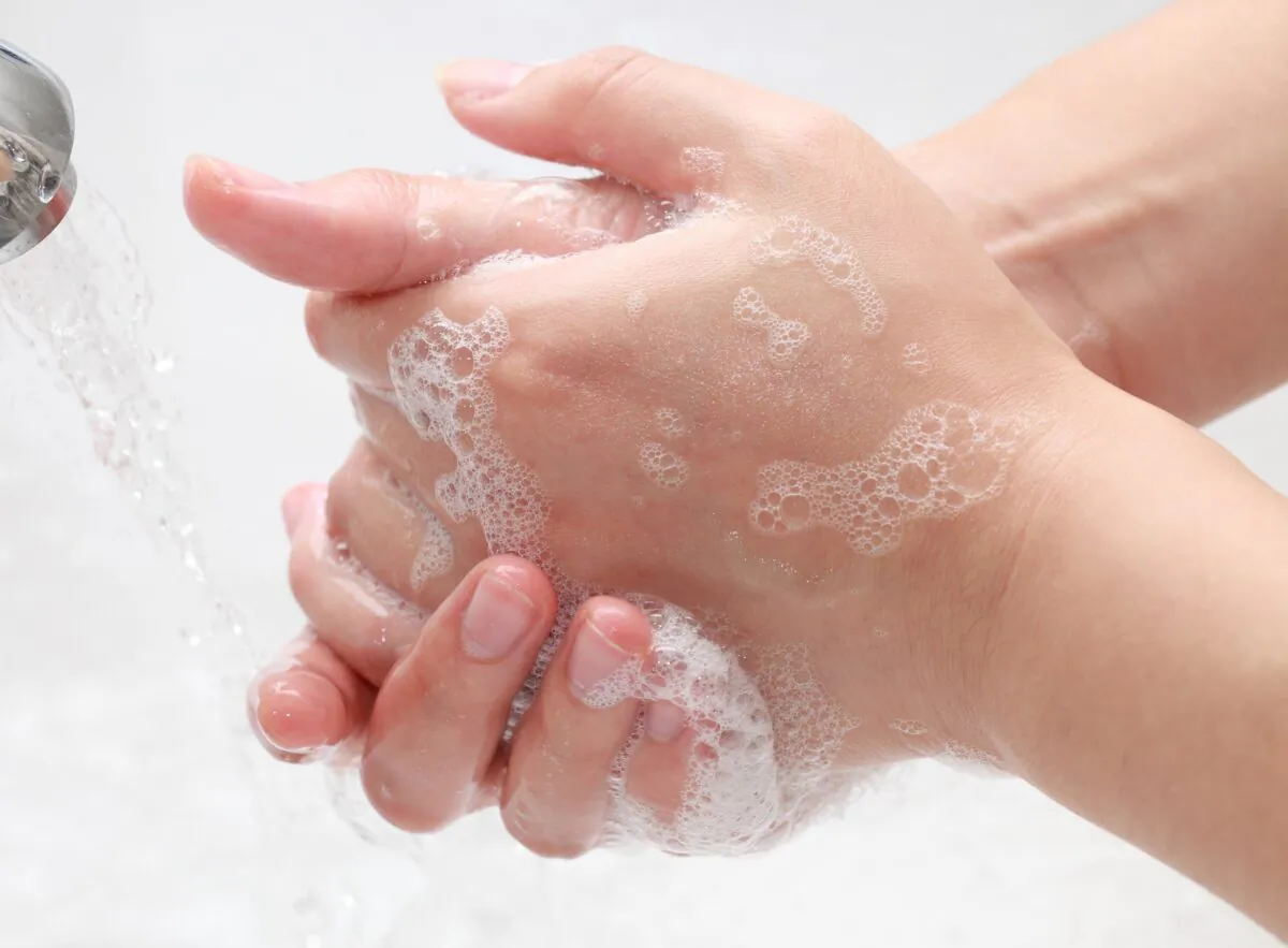 A person washes their hands with soap.
(Gang Liu/Shutterstock)