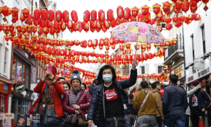 A woman wears a face mask in Chinatown in London on Feb. 2, 2020. (Hollie Adams/Getty Images)