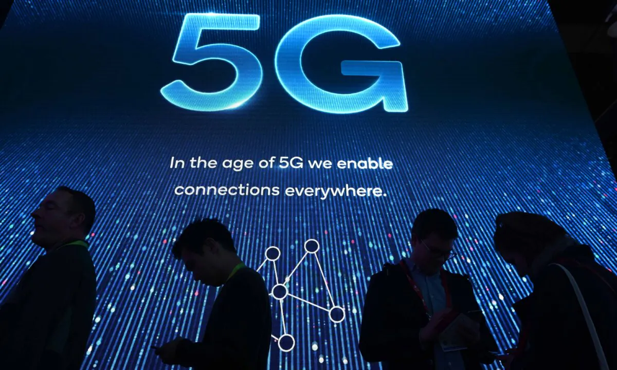 Attendees wait in line for a 5G exhibition at the Qualcomm booth during CES 2019 consumer electronics show at the Las Vegas Convention Center in Las Vegas, Nev., on Jan. 10, 2019. (Robyn Beck/AFP via Getty Images)