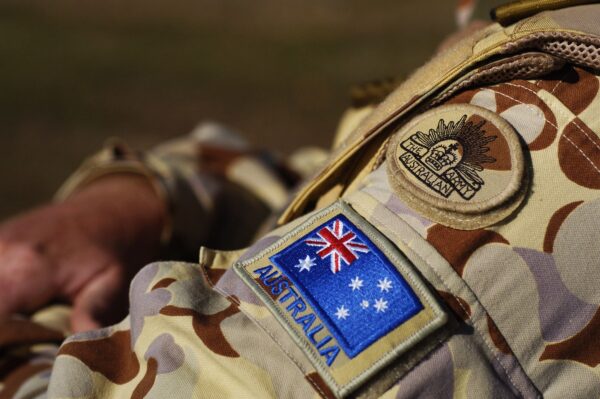The Australian Army insignia and the Australian flag on military uniform