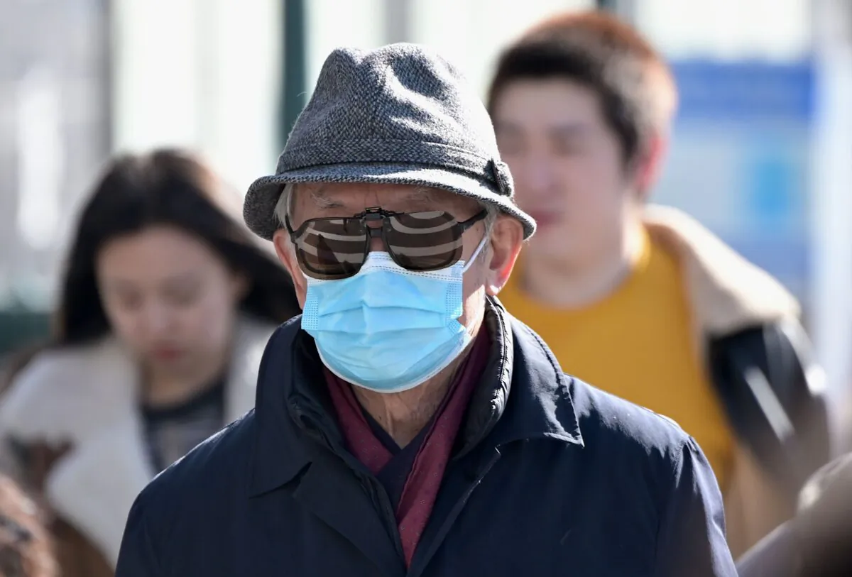 People wear surgical masks in Flushing in the New York City borough of Queens on Feb. 3, 2020. (Johannes Eisele/AFP via Getty Images)
