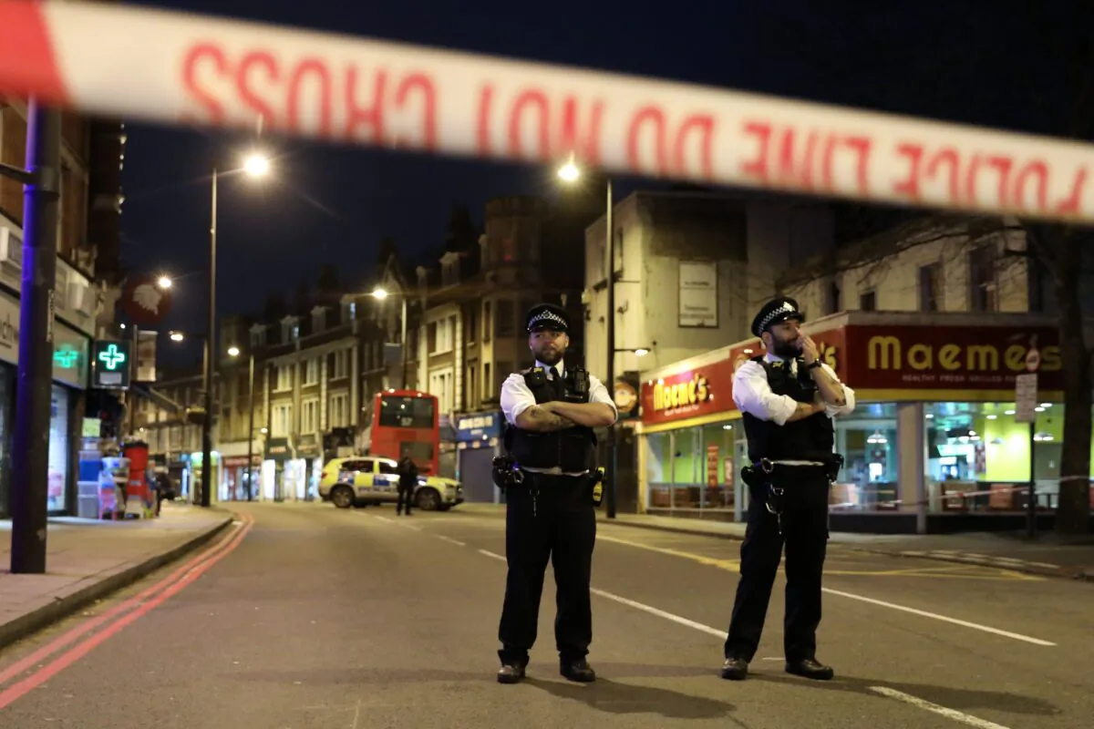 Police officers in Streatham, South London, after at least two people were stabbed in a suspected "terrorist-related" incident on Feb. 2, 2020. (Isabel Infantes/AFP via Getty Images)