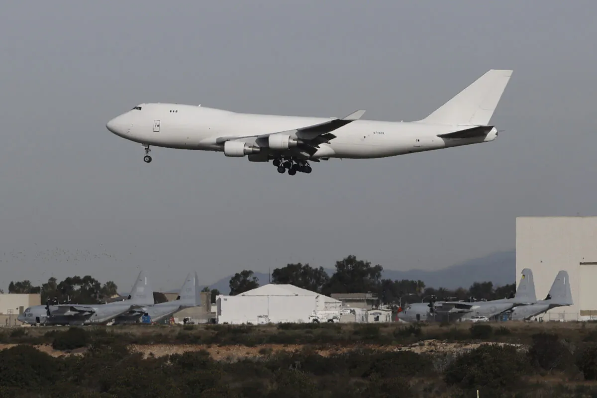 A plane carrying evacuees from the virus zone in China lands at Marine Corps Air Station Miramar in San Diego, Calif., on Feb. 5, 2020. (Gregory Bull/AP Photo)