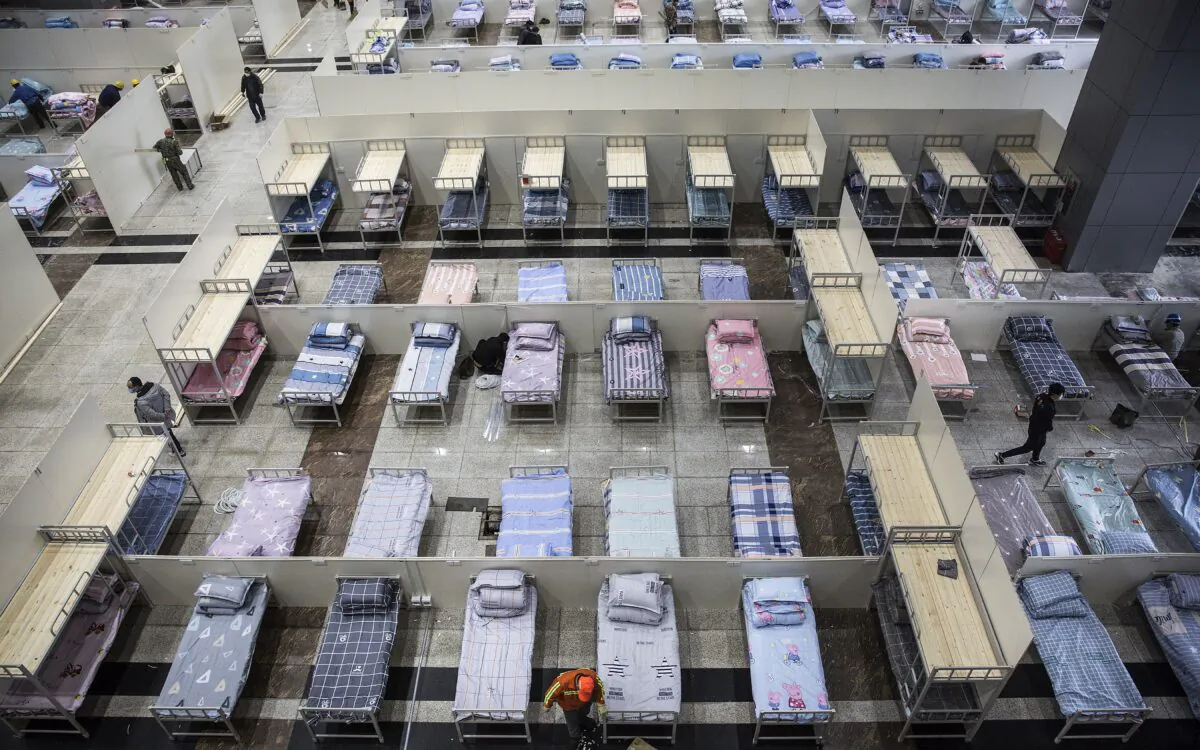 Workers continue to prepare beds at Wuhan International Conference and Exhibition Center in Wuhan, China on Feb. 4, 2020. (Getty Images)