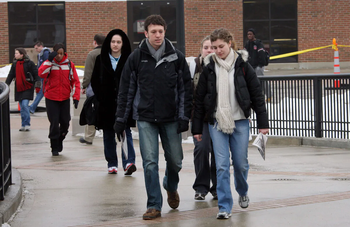Students pass by Cole Hall as they walk to class at Northern Illinois University in DeKalb, Ill., on Feb. 25, 2008. (Scott Olson/Getty Images)