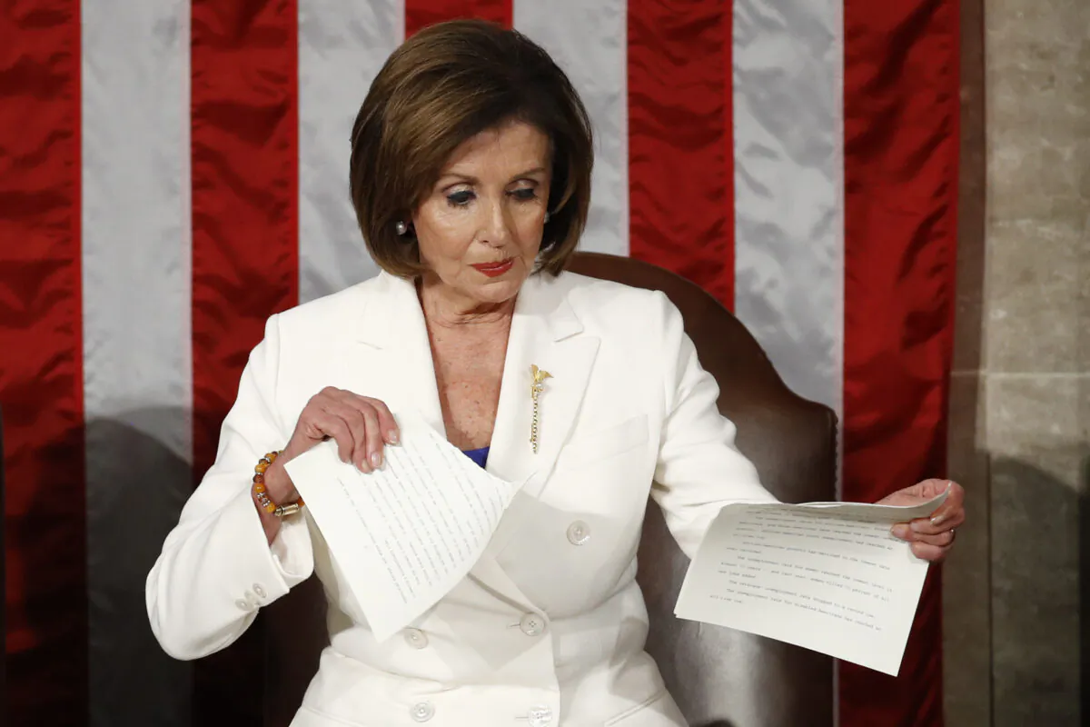 House Speaker Nancy Pelosi (D-Calif.) tears her copy of President Donald Trump's State of the Union address after he delivered it to a joint session of Congress on Capitol Hill, in Washington on Feb. 4, 2020. (Patrick Semansky/AP Photo)