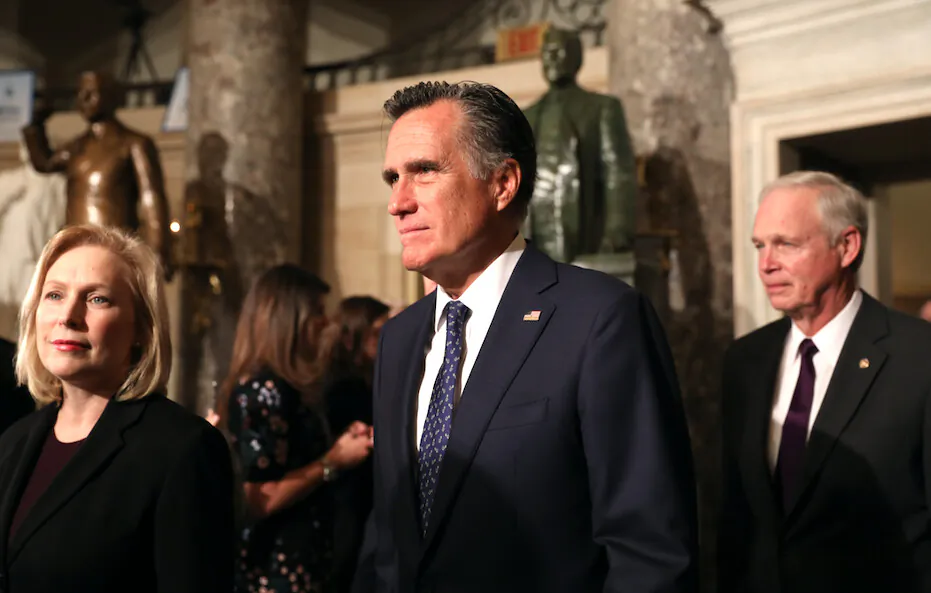 Sen. Mitt Romney (R-Utah) walks through Statuary Hall with other senators to the House Chamber for President Donald Trump’s State of the Union address in the Capitol in Washington on Feb. 4, 2020. (Charlotte Cuthbertson/The Epoch Times)