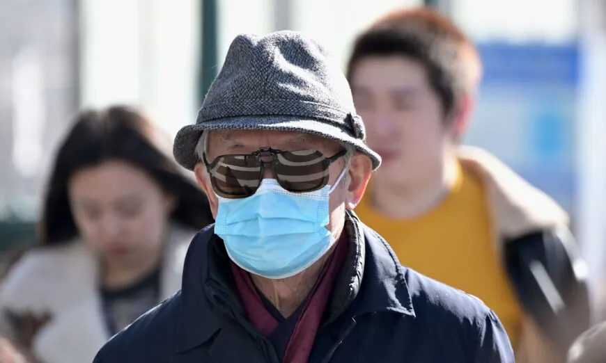A man wears surgical mask in Flushing, a neighborhood in the New York City borough of Queens, on Feb. 3, 2020. (Johannes Eisele/AFP via Getty Images)