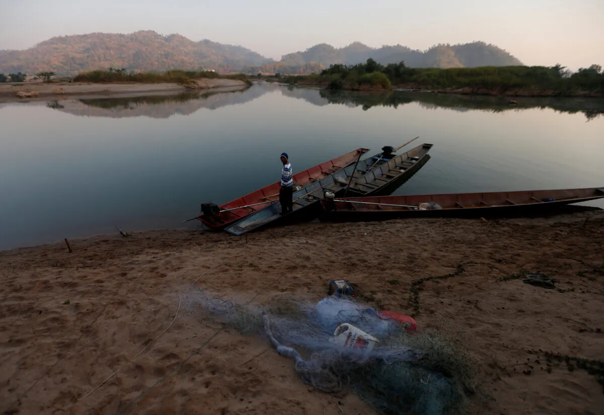 A fisherman is seen on the  Mekong River bank outside Nong Khai, Thailand on Jan. 10, 2020. (Soe Zeya Tun/Reuters)