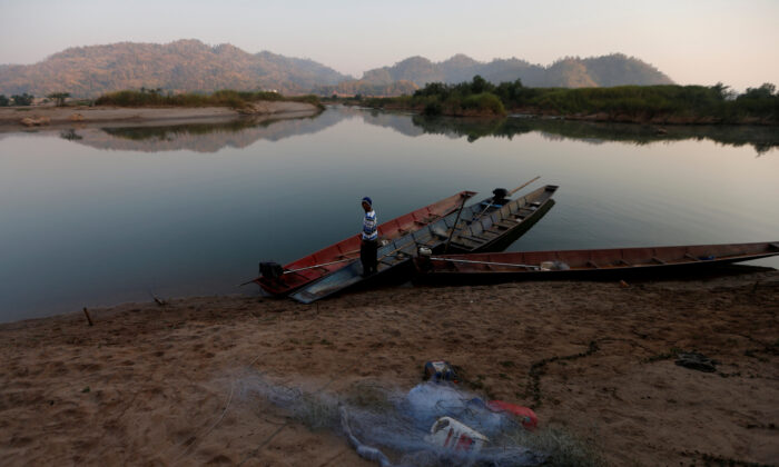 A fisherman is seen on the  Mekong River bank outside Nong Khai, Thailand on Jan. 10, 2020. (Soe Zeya Tun/Reuters)