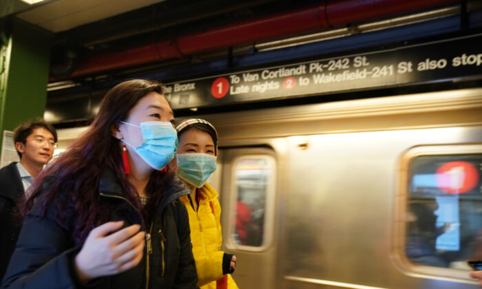 People wear surgical masks in the subway station at Times Square in New York on Jan. 31, 2020. (Bryan R Smith/Reuters)