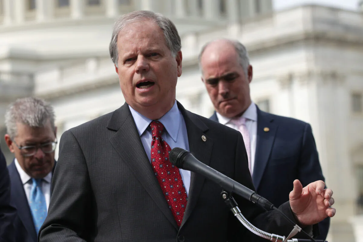 Sen. Doug Jones (D-Ala.) speaks during a news conference on healthcare on Capitol Hill in Washington on April 30, 2019. (Alex Wong/Getty Images)