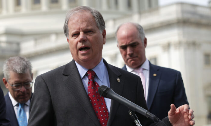 Sen. Doug Jones (D-Ala.) speaks during a news conference on healthcare on Capitol Hill in Washington on April 30, 2019. (Alex Wong/Getty Images)