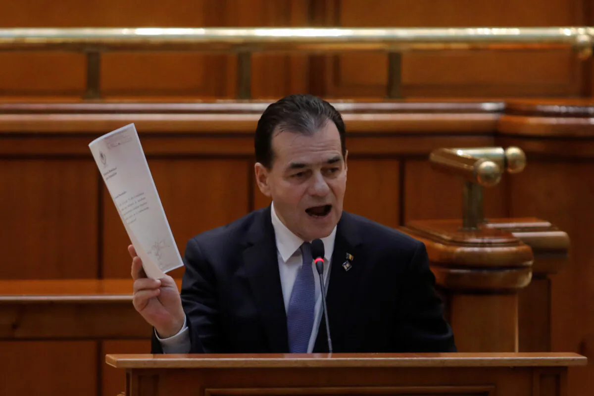 Romanian interim Prime Minister Ludovic Orban delivers a speech before a no-confidence vote session in the Romanian Parliament in Bucharest on Feb. 5, 2020. (George Calin/Inquam Photos via Reuters)