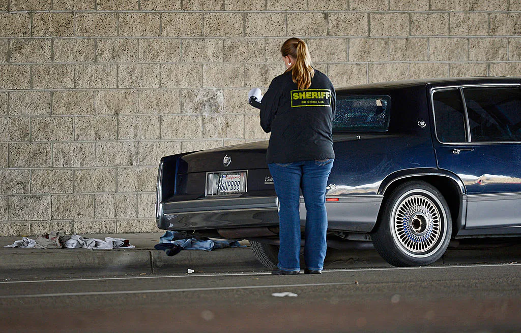 A file photo of Orange County Sheriff deputies investigating a crime scene in Tustin, Calif., on Feb. 19, 2013. (Kevork Djansezian/Getty Images)