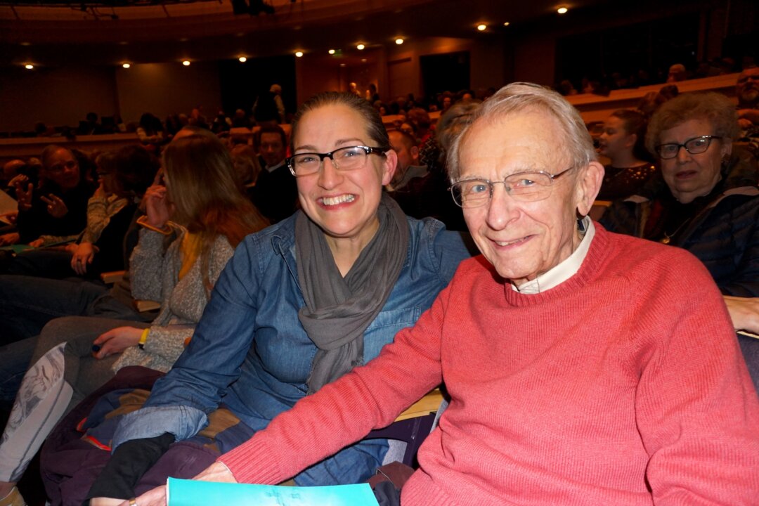 Sarah Marty (L), the producing artistic director of the Four Seasons Theatre, and Michael Leckrone, who recently retired from directing the University of Wisconsin Marching Band, after seeing Shen Yun Performing Arts at Madison’s Overture Center for the Arts, on Feb. 5, 2020. (Catherine Wen/The Epoch Times)