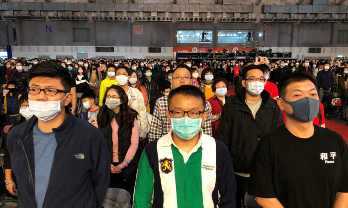 Foxconn employees wearing masks attend the company's year-end gala in Taipei, Taiwan on Jan. 22, 2020. (Yimou Lee/Reuters)