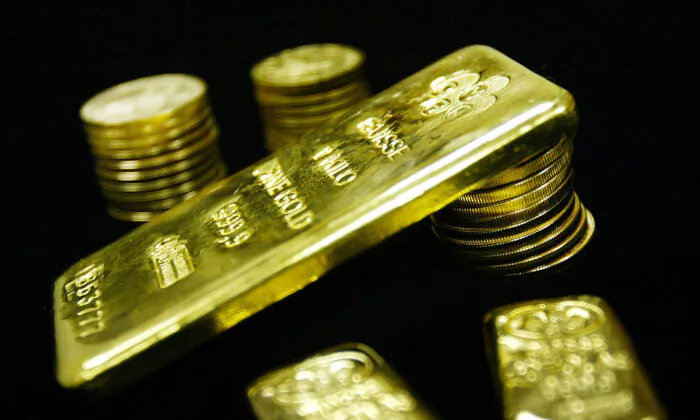 Gold bullion bars and coins are seen for sale, in this file photo. (Mario Tama/Getty Images)