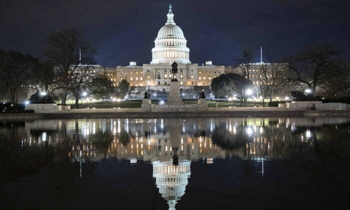 The U.S. Capitol is reflected in the Capitol Reflecting Pool shortly after midnight in Washington Feb. 5, 2020. (Daniel Pierce Wright/Getty Images)