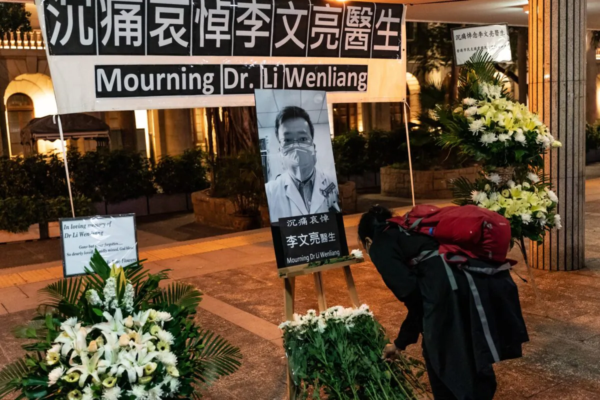 People attend a vigil to mourn for doctor Li Wenliang in Hong Kong on Feb. 7, 2020. (Anthony Kwan/Getty Images)