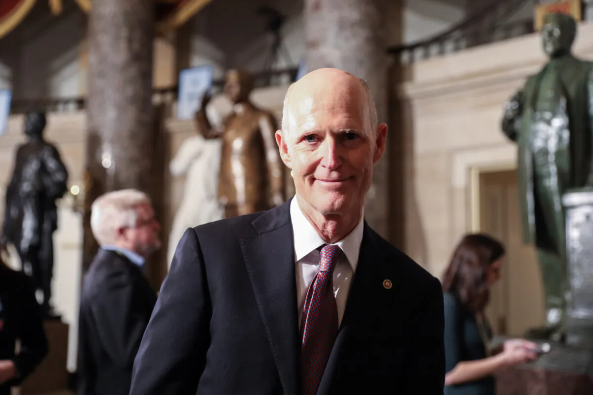 Sen. Rick Scott (R-Fla.) walks through Statuary Hall to the House Chamber for President Donald Trump’s State of the Union address in the Capitol in Washington on Feb. 4, 2020. (Charlotte Cuthbertson/The Epoch Times)