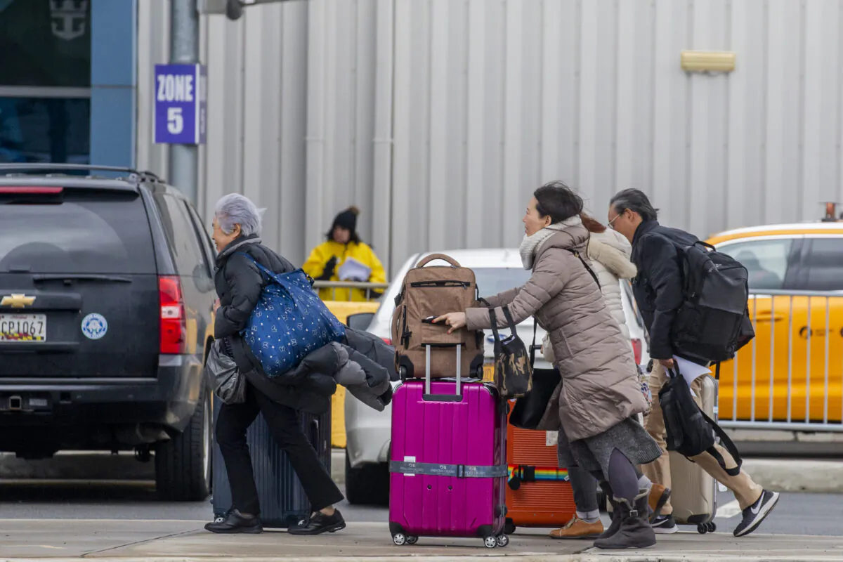 People exit the port after being aboard of Royal Caribbean Cruise Ship Anthem of the Seas in Bayonne, New Jersey, on Feb. 7, 2020. (Eduardo Munoz Alvarez/Getty Images)