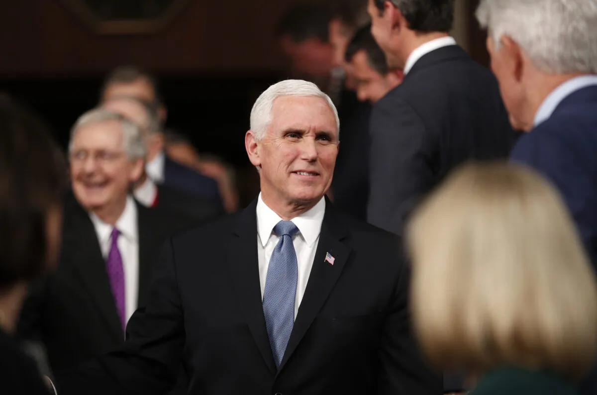 U.S. Vice President Mike Pence arrives in front of Senate Majority Leader Mitch McConnell for U.S. President Donald Trump's State of the Union address to a joint session of the U.S. Congress in the House Chamber of the U.S. Capitol in Washington, D.C. on Feb. 4, 2020. (Leah Millis/Reuters)